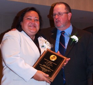 Mable Serrano receives Labor Person of the Year Award from Tom Tighe